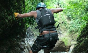 Person jumping into a river