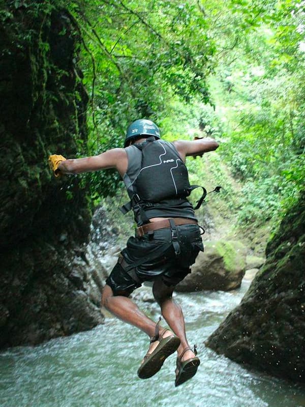 Person jumping into a river