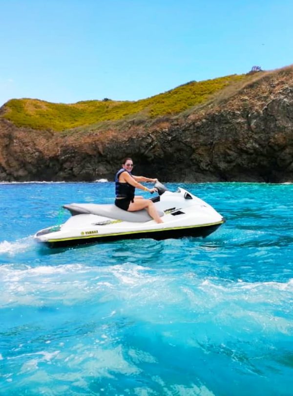 Person riding jet ski on water.