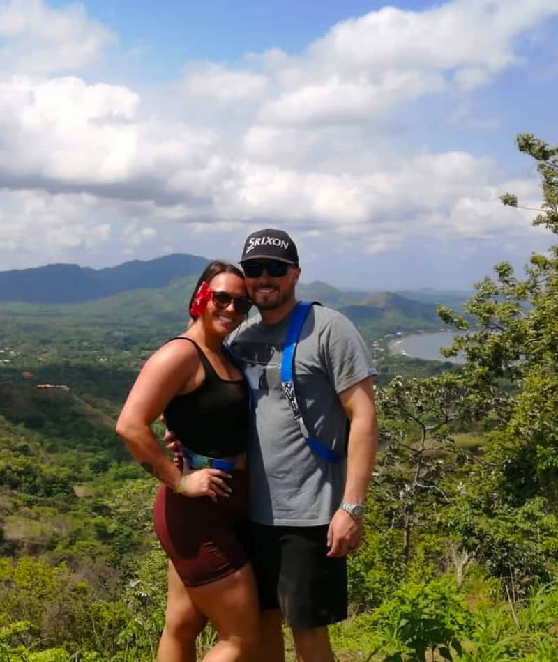 Couple enjoying a scenic mountain view.